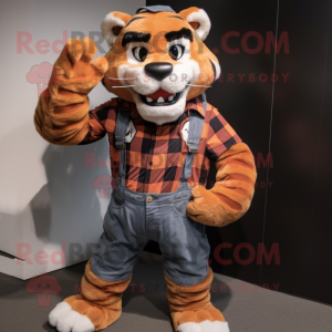 Rust Saber-Toothed Tiger mascot costume character dressed with a Flannel Shirt and Suspenders