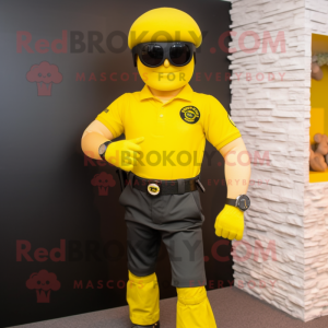 Yellow Para Commando mascot costume character dressed with a Polo Shirt and Bracelet watches