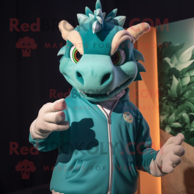 Teal Dragon mascot costume character dressed with a Sweatshirt and Rings Teal Dragon mascot costume character dressed with a Sweatshirt and Rings