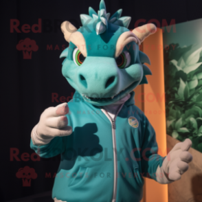 Teal Dragon mascot costume character dressed with a Sweatshirt and Rings
