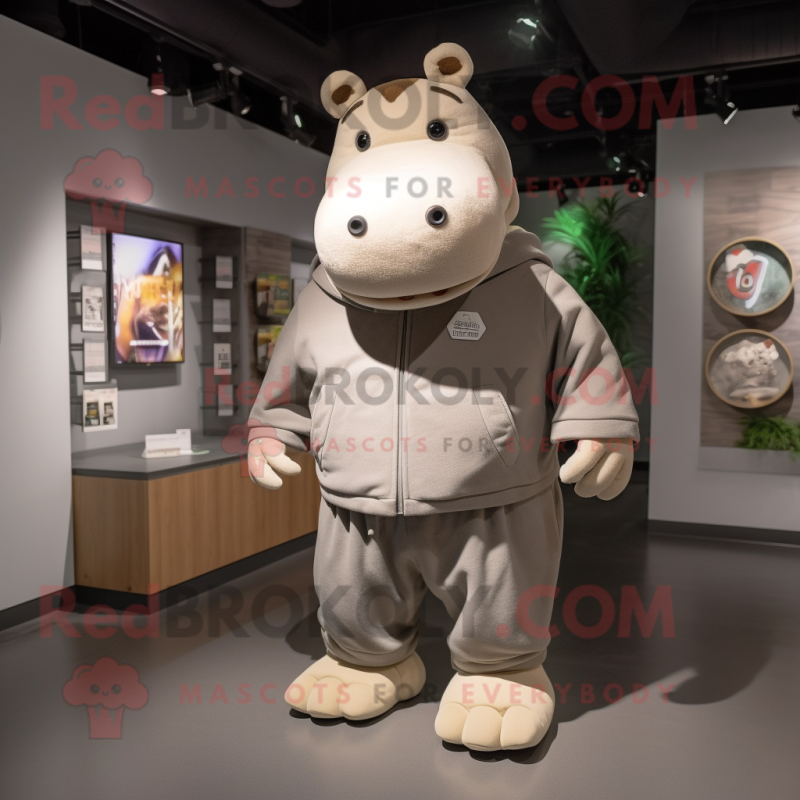 Tan Hippopotamus mascot costume character dressed with a Sweatshirt and Lapel pins Tan Hippopotamus mascot costume character dressed with a Sweatshirt and Lapel pins