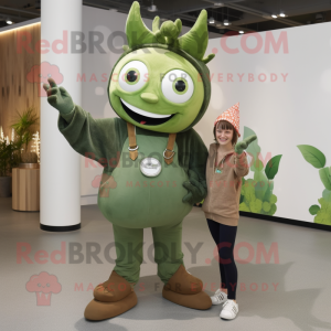 Olive Tooth Fairy mascot costume character dressed with a Dungarees and Rings