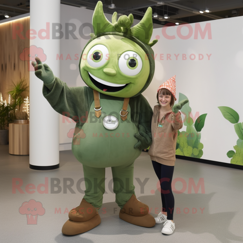 Olive Tooth Fairy mascot costume character dressed with a Dungarees and Rings Olive Tooth Fairy mascot costume character dressed with a Dungarees and Rings