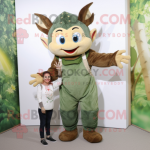 Olive Tooth Fairy mascot costume character dressed with a Dungarees and Rings