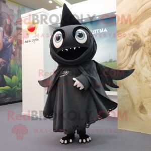 Black Tuna mascot costume character dressed with a Playsuit and Shawls