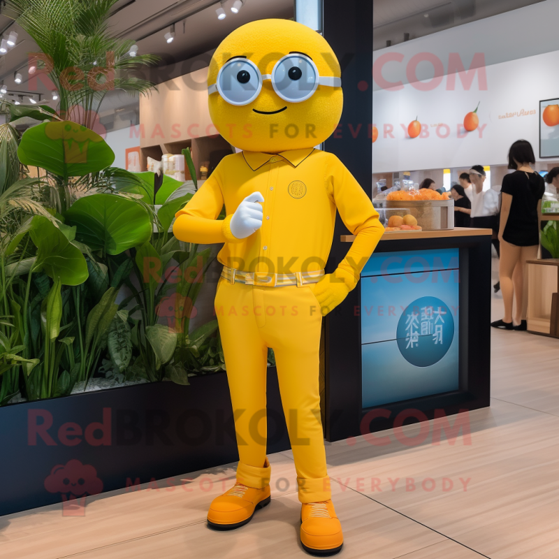 Lemon Yellow Mandarin mascot costume character dressed with a Jeggings and Smartwatches