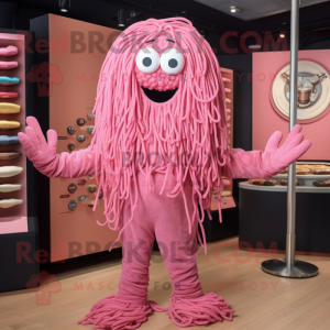 Pink Spaghetti mascot costume character dressed with a T-Shirt and Lapel pins