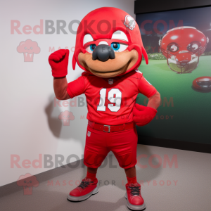 Red American Football Helmet mascot costume character dressed with a Bermuda Shorts and Earrings