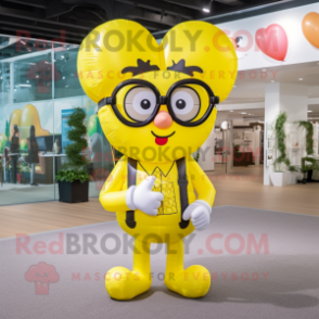 Yellow Heart Shaped Balloons mascot costume character dressed with a Romper and Reading glasses