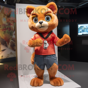 Peach Jaguarundi mascot costume character dressed with a Skinny Jeans and Gloves