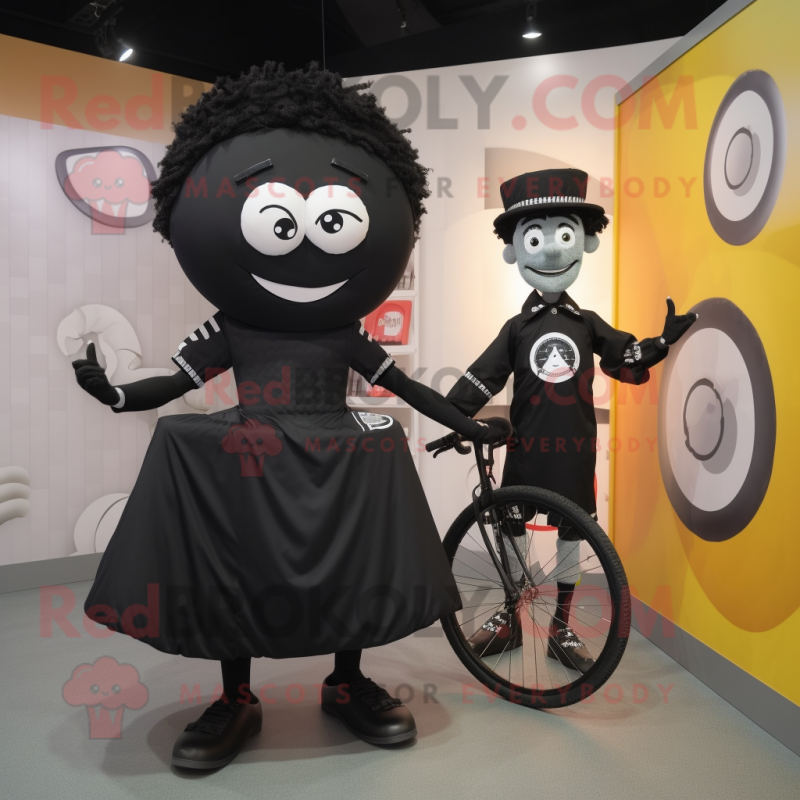 Black Unicyclist mascot costume character dressed with a Wrap Dress and Ties Black Unicyclist mascot costume character dressed with a Wrap Dress and Ties