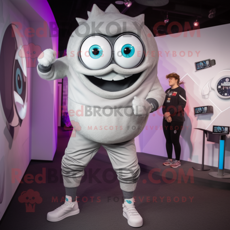 Silver Cyclops mascot costume character dressed with a Joggers and Smartwatches Silver Cyclops mascot costume character dressed with a Joggers and Smartwatches