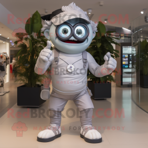 Silver Cyclops mascot costume character dressed with a Joggers and Smartwatches