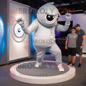 Silver Cyclops mascot costume character dressed with a Joggers and Smartwatches
