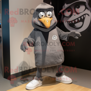 Gray Blackbird mascot costume character dressed with a Henley Tee and Shoe laces