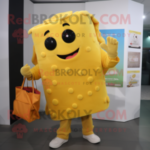 Yellow Lasagna mascot costume character dressed with a Trousers and Tote bags