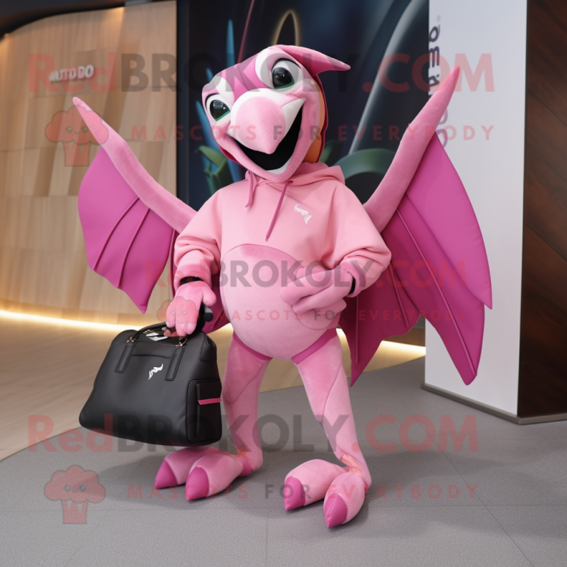 Pink Pterodactyl mascot costume character dressed with a Sweatshirt and Handbags Pink Pterodactyl mascot costume character dressed with a Sweatshirt and Handbags