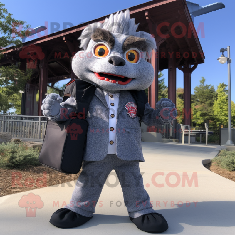 Gray Fire Eater mascot costume character dressed with a Suit Jacket and Backpacks Gray Fire Eater mascot costume character dressed with a Suit Jacket and Backpacks