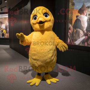 Yellow Blackbird mascot costume character dressed with a Playsuit and Mittens