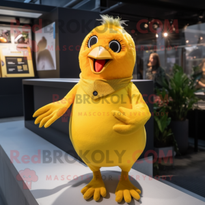 Yellow Blackbird mascot costume character dressed with a Playsuit and Mittens
