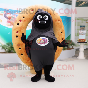 Black Bagels mascot costume character dressed with a One-Piece Swimsuit and Shawls