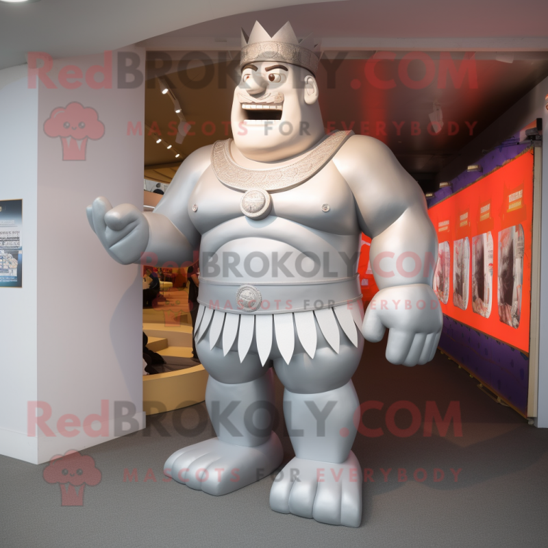 Silver Strongman mascot costume character dressed with a Sheath Dress and Anklets Silver Strongman mascot costume character dressed with a Sheath Dress and Anklets