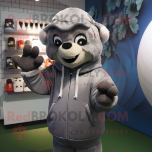 Gray Rugby Ball mascot costume character dressed with a Hoodie and Gloves