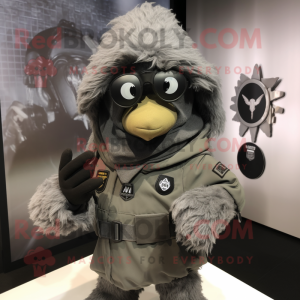 Gray Para Commando mascot costume character dressed with a Graphic Tee and Shawl pins