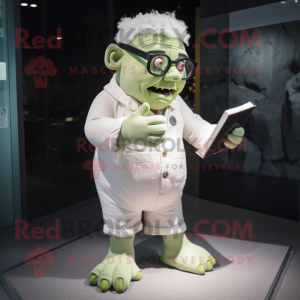 Cream Frankenstein'S Monster mascot costume character dressed with a Playsuit and Reading glasses