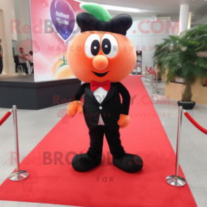 Peach Strawberry mascot costume character dressed with a Tuxedo and Shoe laces