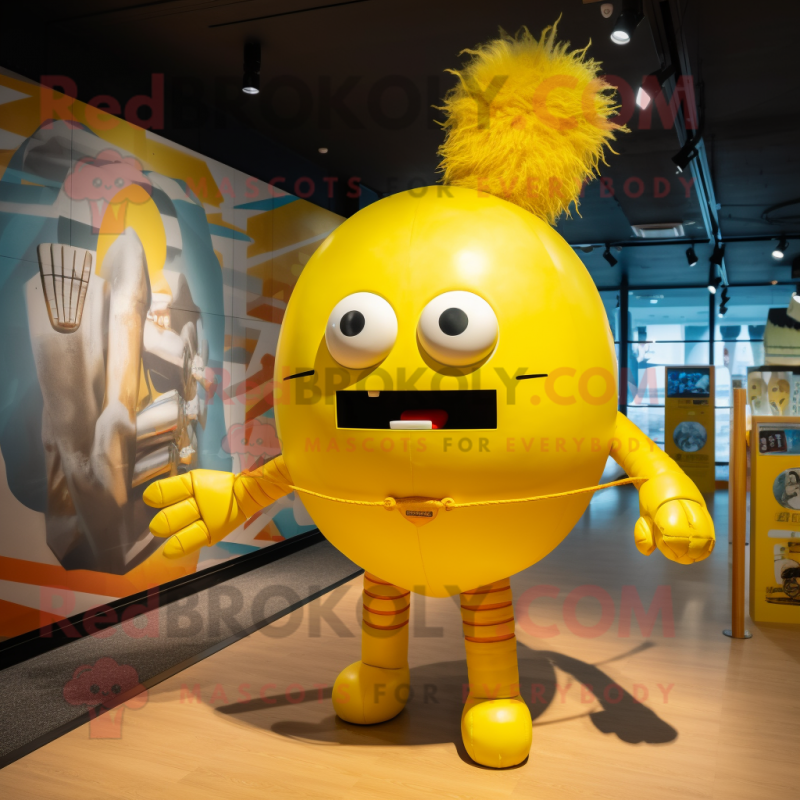 Yellow Human Cannon Ball mascot costume character dressed with a Graphic Tee and Hairpins Yellow Human Cannon Ball mascot costume character dressed with a Graphic Tee and Hairpins