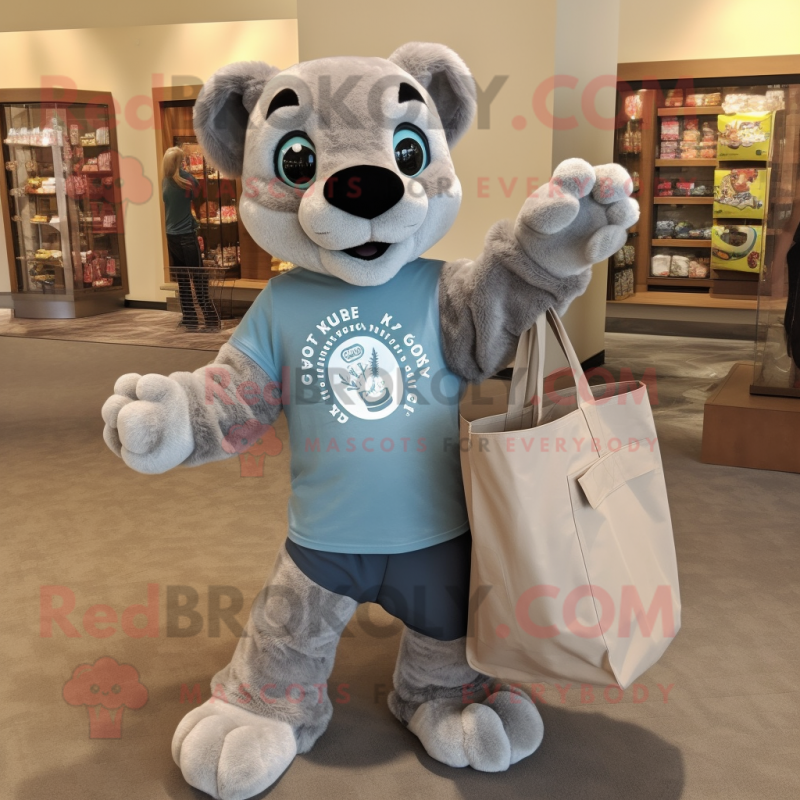 Gray Mountain Lion mascot costume character dressed with a Long Sleeve Tee and Tote bags