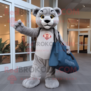 Gray Mountain Lion mascot costume character dressed with a Long Sleeve Tee and Tote bags