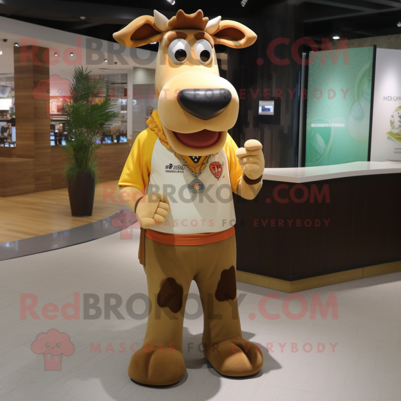 Tan Jersey Cow mascot costume character dressed with a Graphic Tee and Keychains Tan Jersey Cow mascot costume character dressed with a Graphic Tee and Keychains