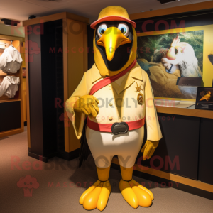 Gold Toucan mascot costume character dressed with a Coat and Cummerbunds