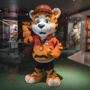 Orange Tiger mascot costume character dressed with a Rugby Shirt and Hat pins
