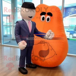 Peach Boxing Glove mascot costume character dressed with a Blazer and Tote bags