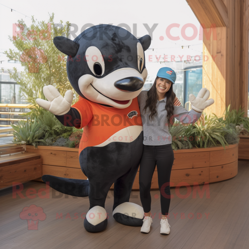 Rust Killer Whale mascot costume character dressed with a Mom Jeans and Headbands Rust Killer Whale mascot costume character dressed with a Mom Jeans and Headbands
