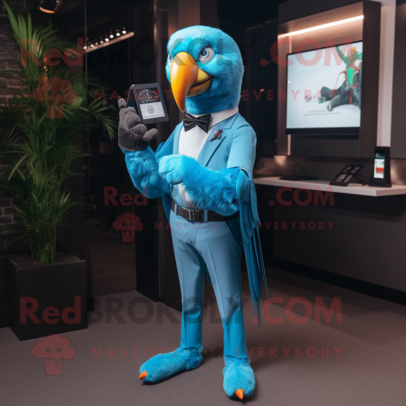 Sky Blue Parrot mascot costume character dressed with a Suit Pants and Smartwatches Sky Blue Parrot mascot costume character dressed with a Suit Pants and Smartwatches