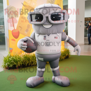 Gray American Football Helmet mascot costume character dressed with a Dress Pants and Eyeglasses