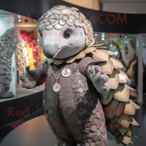 Gray Pangolin mascot costume character dressed with a Playsuit and Brooches
