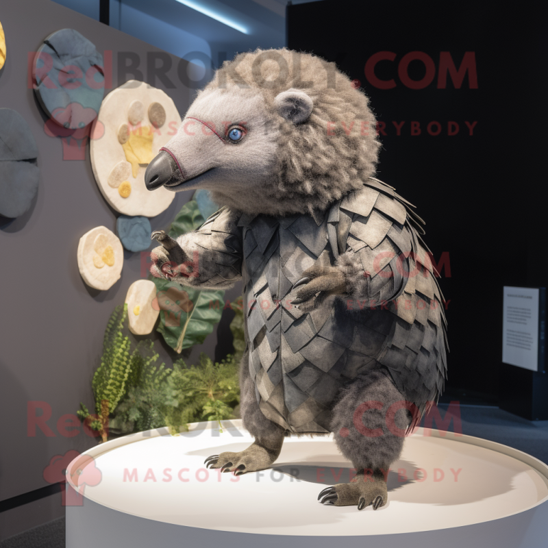 Gray Pangolin mascot costume character dressed with a Playsuit and Brooches Gray Pangolin mascot costume character dressed with a Playsuit and Brooches