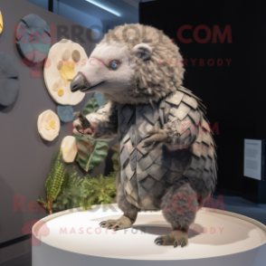 Gray Pangolin mascot costume character dressed with a Playsuit and Brooches