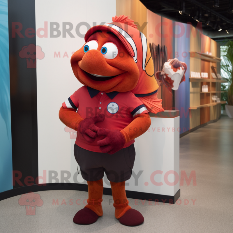 Maroon Clown Fish mascot costume character dressed with a Polo Tee and Watches Maroon Clown Fish mascot costume character dressed with a Polo Tee and Watches