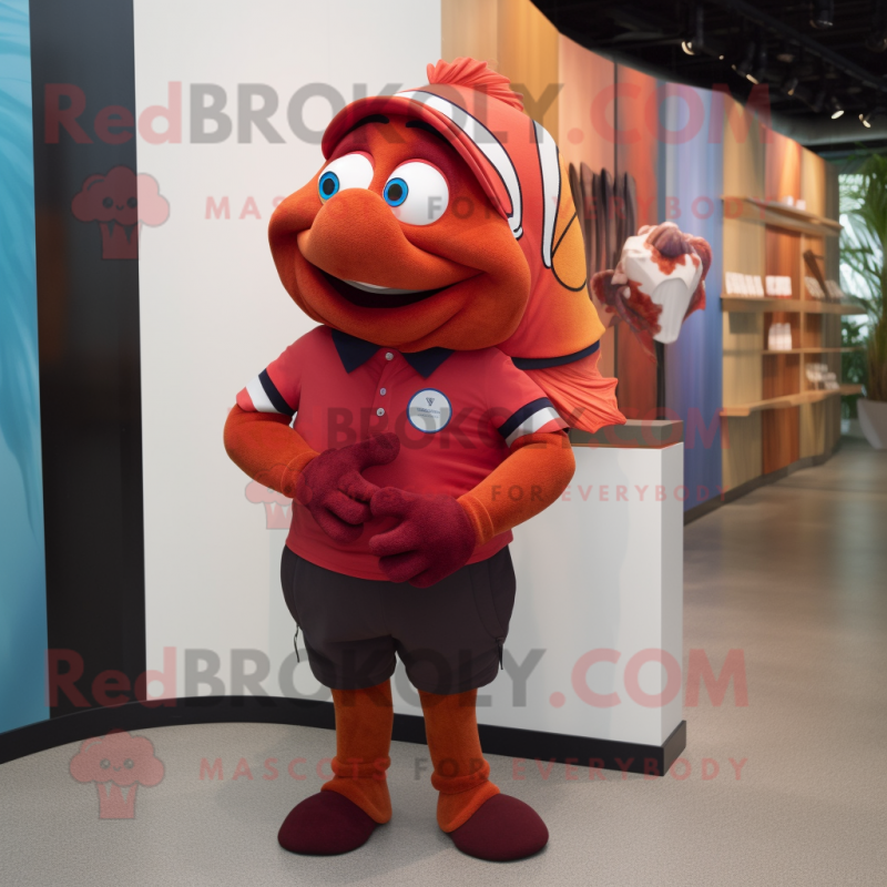 Maroon Clown Fish mascot costume character dressed with a Polo Tee and Watches