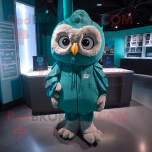 Teal Owl mascot costume character dressed with a Hoodie and Coin purses