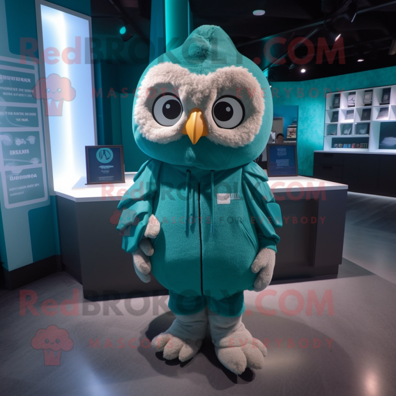 Teal Owl mascot costume character dressed with a Hoodie and Coin purses Teal Owl mascot costume character dressed with a Hoodie and Coin purses