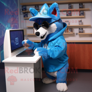Blue Dingo mascot costume character dressed with a Hoodie and Reading glasses