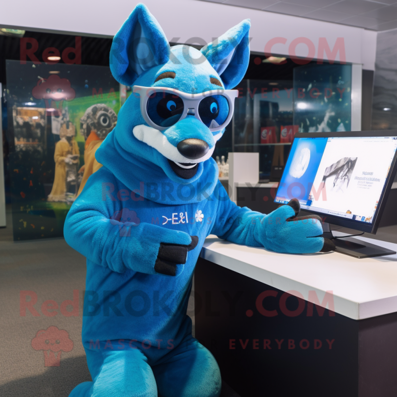 Blue Dingo mascot costume character dressed with a Hoodie and Reading glasses