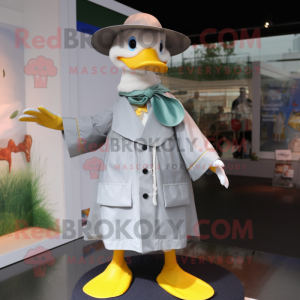 Gray Duck mascot costume character dressed with a Raincoat and Hat pins